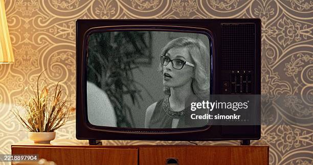 retro crt television displaying black and white movie scene in vintage room setting - analog stock pictures, royalty-free photos & images