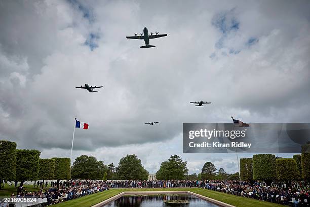 Military aircraft perform a flyover during a ceremony to mark the 81st anniversary of the D-Day landings during World War II at the Normandy American...