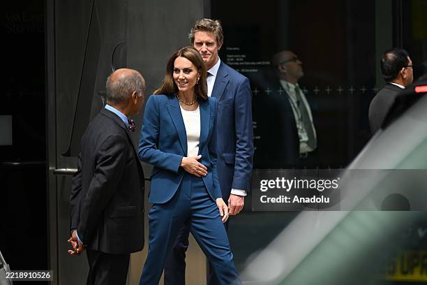 Princess Kate of Wales speaks to officials as she leaves the V&A East Storehouse in London's Stratford neighborhood on June 10, 2025. She was...