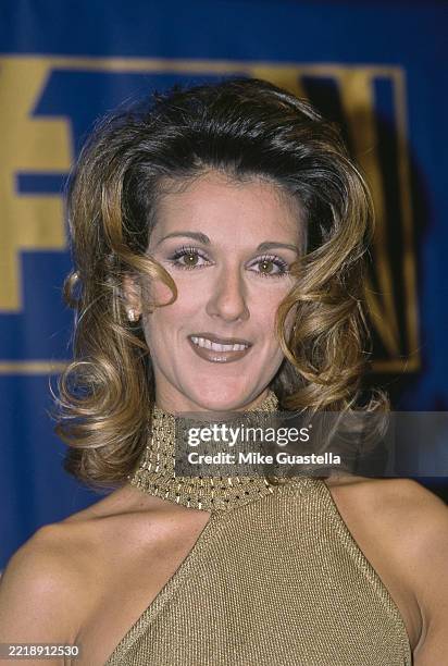 Canadian singer Celine Dion, wearing a gold halterneck dress, in the 7th Annual Billboard Music Awards press room at the Hard Rock Hotel & Casino...