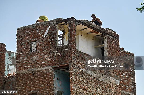View of Residents of Kalkaji bhoomiheen Bhoomiheen Jhugi jhopri Camp collecting valuable items in their house before the demolition drive, on June...
