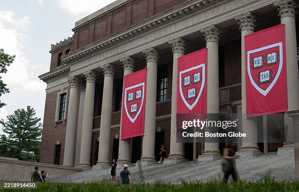 Cambridge, MA People walk past the Harry Elkins Widener Memorial Library on Harvard's campus on June 5, 2025.