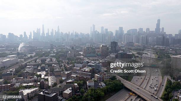 An aerial view shows smoke from Canadian wildfires dimming the city's skyline on June 06, 2025 in Chicago, Illinois. The city has been under an air...