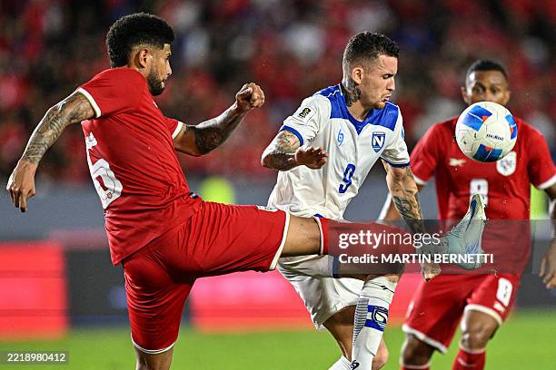 Panama's midfielder Cristian Martinez and Nicaragua's forward Jaime Moreno fight for the ball during the 2026 FIFA World Cup Concacaf qualifier...