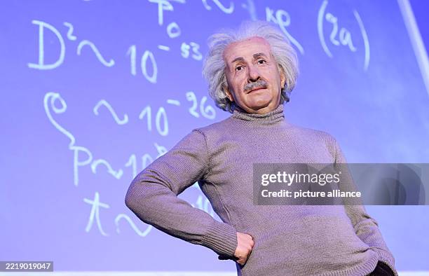 The wax figure of Albert Einstein stands on the stage of the Archenhold Observatory during a photo session in front of original formulas for the...