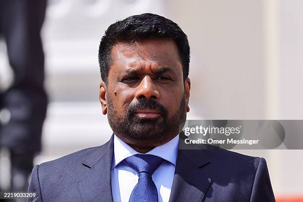 Sri Lankan President Anura Kumara Dissanayake stands for the national anthems after being welcomed by German President Frank-Walter Steinmeier at...