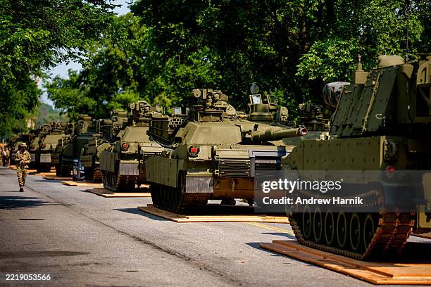 Army soldiers work on an assortment of M1 Alpha a3 Abrams tanks, stryker armored vehicles, and M2 Bradley fighting vehicles at West Potomac Park...