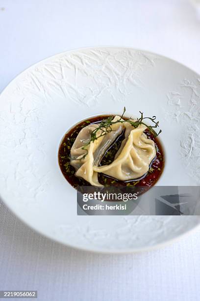 a plate full of food made for gourmets - tortellini stock pictures, royalty-free photos & images