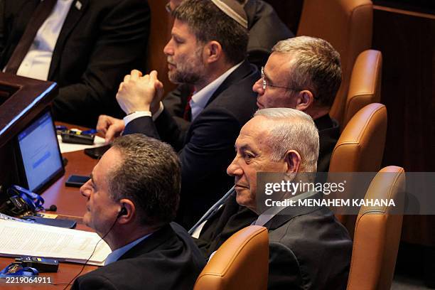 Israel's Finance Minister Bezalel Smotrich, Justice Minister Yariv Levin, Prime Minister Benjamin Netanyahu, and Defence Minister Israel Katz attend...