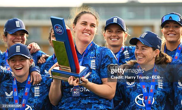 Nat Sciver-Brunt of England poses with the Trophy following the 3rd Women's Metro Bank ODI match between England and West Indies at The Cooper...