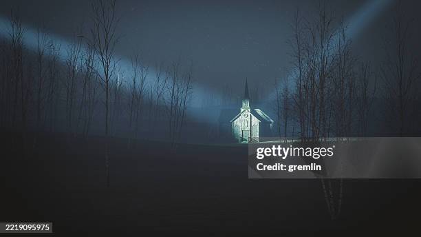 vecchia chiesa illuminata da luci misteriose - malvagità foto e immagini stock