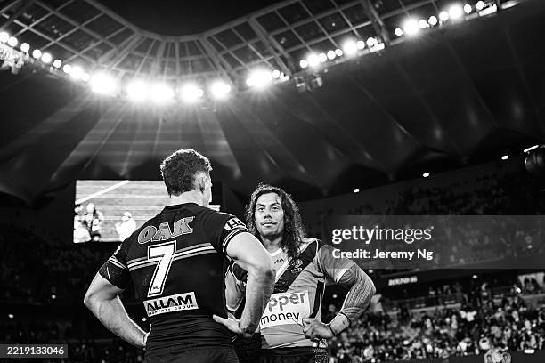 Jarome Luai of the Tigers embraces with Nathan Cleary of the Panthers after the round 14 NRL match between Wests Tigers and Penrith Panthers at...