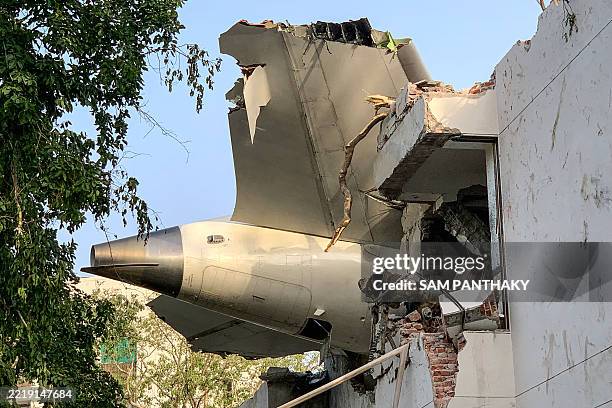 The back of Air India flight 171 is pictured at the site after it crashed in a residential area near the airport in Ahmedabad on June 12, 2025. A...