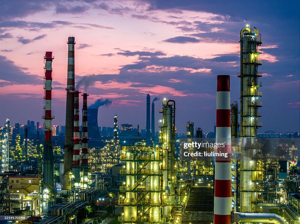 Shot from drone of Oil refinery plant ,Petrochemical plant at dusk