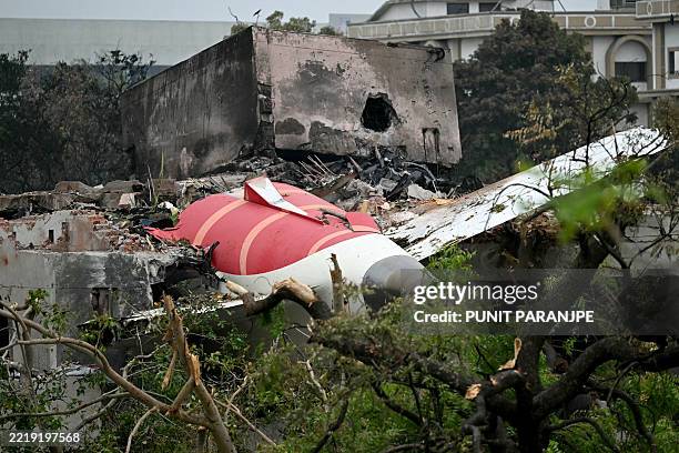 Debris of Air India flight 171 is pictured after it crashed in a residential area near the airport in Ahmedabad on June 13, 2025. Rescue teams with...
