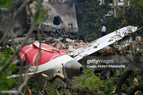Debris of Air India flight 171 is pictured after it crashed in a residential area near the airport in Ahmedabad on June 13, 2025. Rescue teams with...