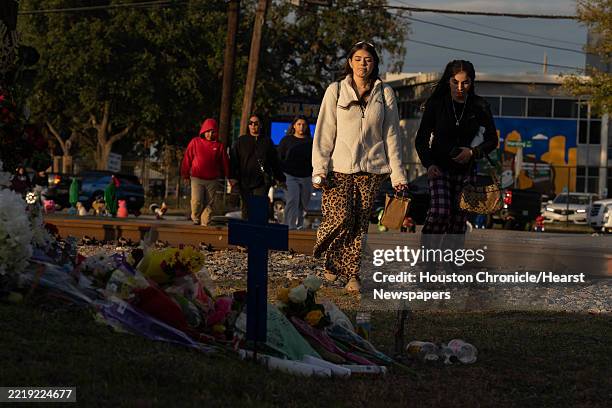 Students pass by a memorial that was created outside Milby High School for Sergio Rodriguez on Thursday December 12, 2024 in Houston, TX. Rodriguez...