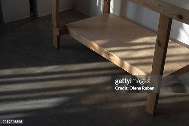 handmade wooden table in a sunny room. - wood slab wall stock pictures, royalty-free photos & images