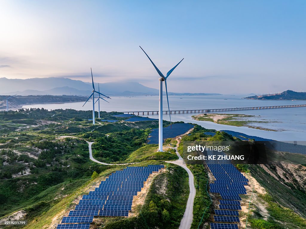 Solar photovoltaic windmill wind energy at sunset