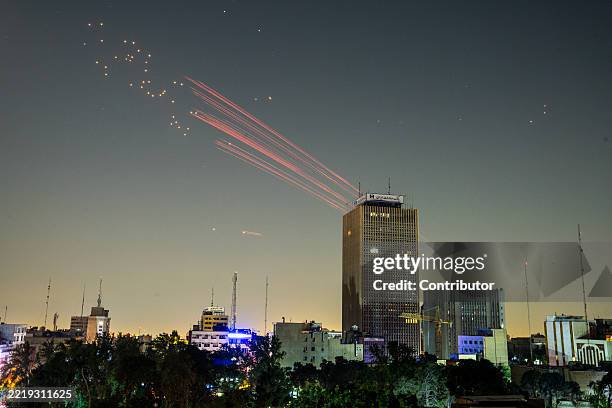 Traces of projectiles are seen in the sky on June 13, 2025 in Tehran, Iran. Iran's foreign minister said the country would respond "decisively and...