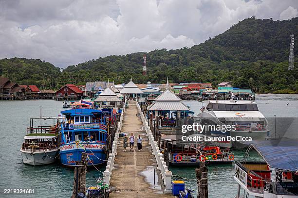 Tourists explore the Bang Bao Pier and Fisherman's village on June 09, 2025 in Koh Chang, Thailand. Koh Chang, which means “Elephant Island” in Thai,...