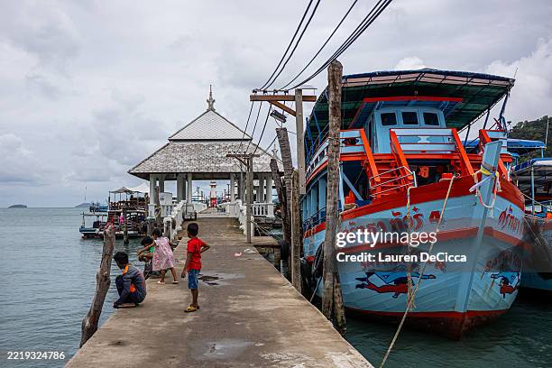 Fishing and diving boats dock at the Bang Bao Pier on the southern tip of the island on June 09, 2025 in Koh Chang, Thailand. Koh Chang, which means...