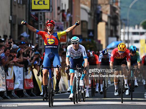 Jonathan Milan of Italy and Team Lidl - Trek celebrates at finish line as stage winner ahead of Fred Wright of Great Britain and Team Bahrain -...
