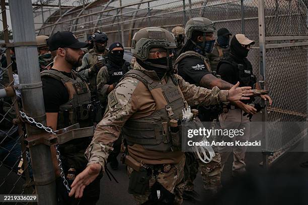 Federal Agents guard the entrance during a protest over federal immigration enforcement raids Delaney Hall Detention Facility on June 13, 2025 in...