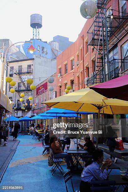 outdoor seating for alfresco dining in doyers street.new york city.usa - chinatown stock pictures, royalty-free photos & images