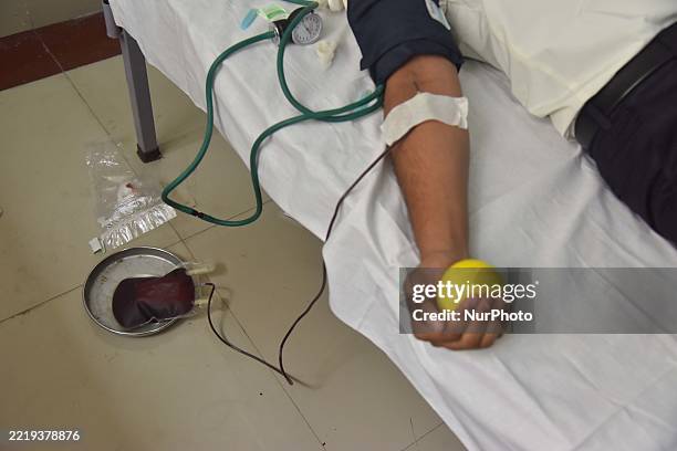 Student donates blood during a blood donation drive on World Blood Donor Day in Nagaon District, Assam, India, on June 14, 2025.
