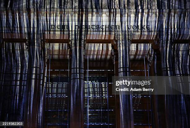 Projection of the "Wrapped Reichstag" by artists Christo and Jeanne-Claude is displayed on the Reichstag building to mark the artwork's 30th...