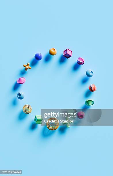 visual harmony – circular composition of multicolored geometric shapes on bold blue background - langzaam stockfoto's en -beelden