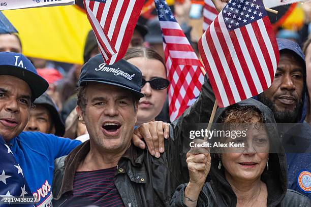 Mark Ruffalo and Susan Sarandon, along with thousands of New Yorkers, march in opposition of Donald Trump's presidency on the day of the military...