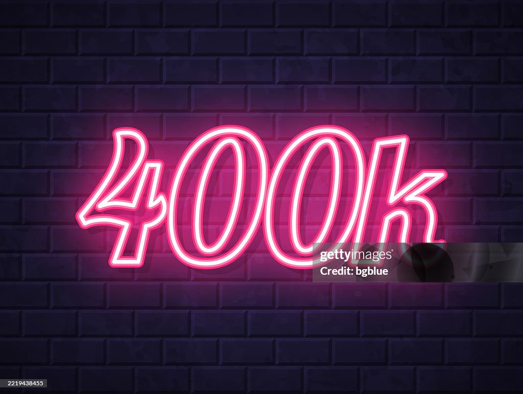 400k - Glowing neon text on brick wall background