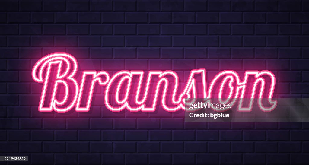 Branson - Glowing neon text on brick wall background