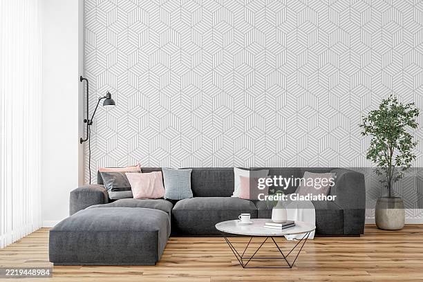 modernes interieur: ein wohn-/wartezimmer mit sofa, couchtisch, weißem und grauem geometrischem ahlenpapierhintergrund und dekoration - innenarchitektur stock-fotos und bilder