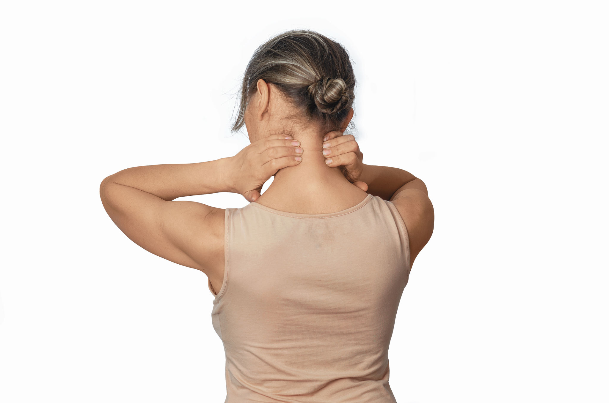 Neck pain prevention. Self-massage of neck muscles, woman in beige T-shirt, isolated on white. Side view. Neck pain prevention. Self-massage of neck muscles, woman in beige T-shirt, isolated on white. Side view.