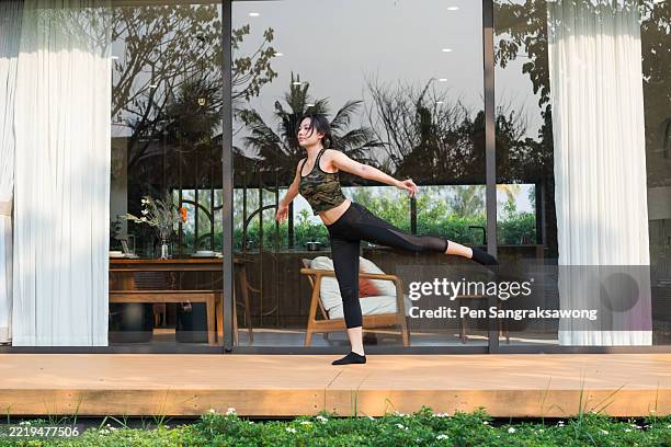 asian teenage girls practicing contemporary dance and gymnastics. - contemporary dance stock pictures, royalty-free photos & images