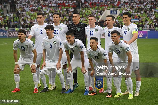 The players of Uzbekistan pose for a team photo prior to kick-off ahead of the FIFA World Cup Qualifier match between Uzbekistan and Qatar at Milliy...