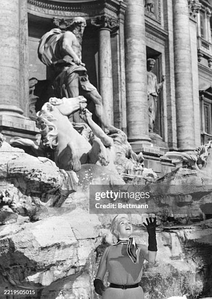 Jayne Rome Jayne Mansfield throws coins into the Trevi Fountain in Rome. News ...