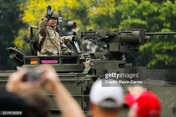 Members of the U.S. Army ride in a M1A2 Abrams Main Battle tank... News ...