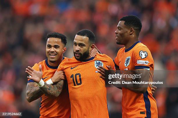 Memphis Depay of Netherlands celebrates scoring his team's second goal with teammates Justin Kluivert and Denzel Dumfries during the FIFA 2026 World...