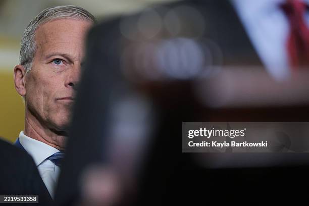 Senate Majority Leader John Thune listens to Sen. Roger Wicker speak during a press conference following the weekly Republican policy luncheon at the...