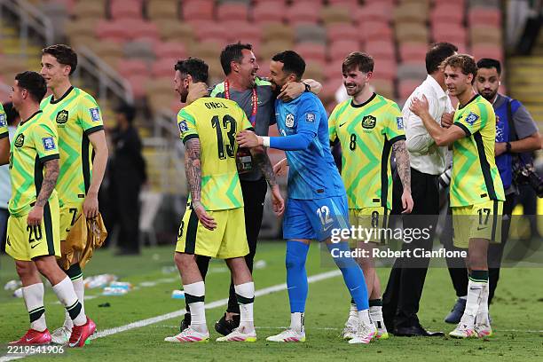 Paul Izzo of Australia and teammates celebrate victory following the 2026 FIFA World Cup Round Three AFC Asian Qualifier match between Saudi Arabia...