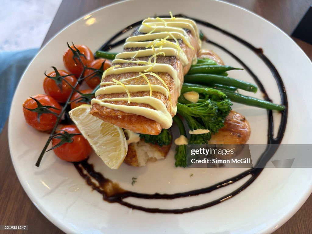 Crispy skin Atlantic salmon, blistered cherry tomato, twice cooked potato, broccoli, green beans, lemon wedge and lemon myrtle hollandaise sauce