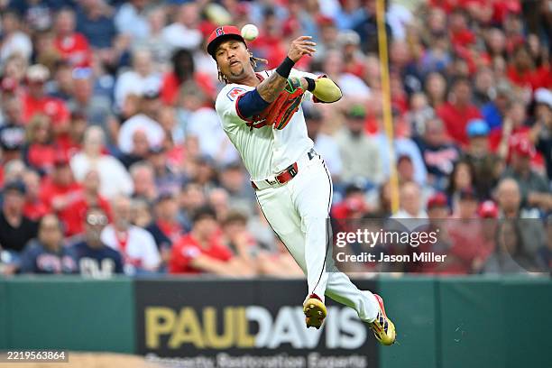 Third baseman José Ramírez of the Cleveland Guardians throws out Christian Encarnacion-Strand of the Cincinnati Reds at first during the sixth inning...