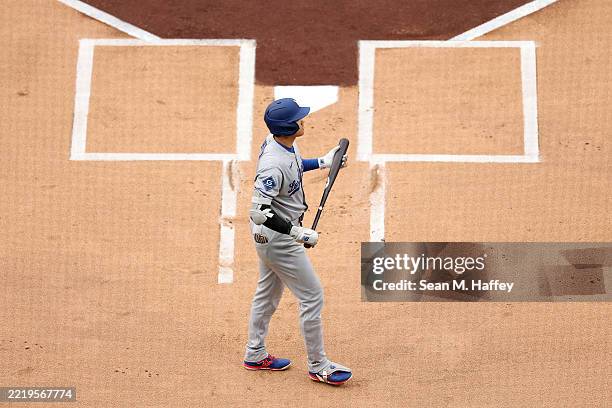 Shohei Ohtani of the Los Angeles Dodgers walks to the plate prior to batting during the first inning of a game against the San Diego Padres at Petco...