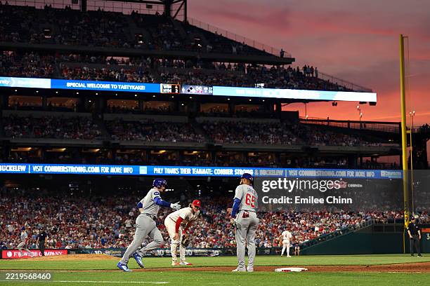 Ian Happ of the Chicago Cubs runs the bases after hitting his second home run of the game in the sixth inning against the Philadelphia Phillies...