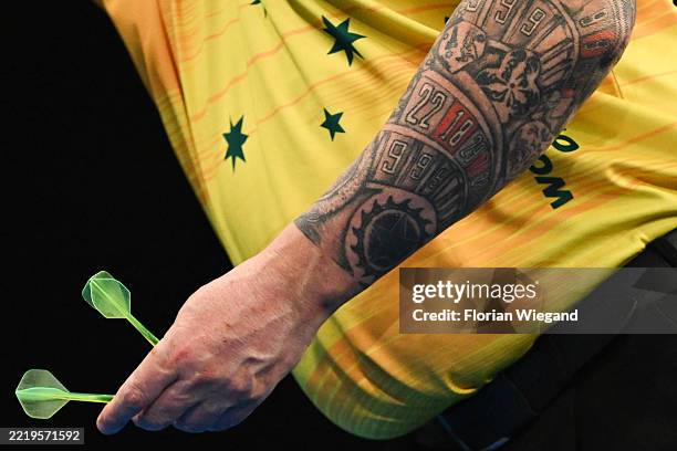 Detailed view of the tattooed left arm of Simon Whitlock of Australia seen during their quarter-final match on day four of BetVictor World Cup of...