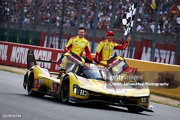 Race winners, the AF Corse Ferrari 499P of Robert Kubica , Yifei Ye, and Philip Hanson celebrate as they enter parc ferme at the end of the Le Mans...